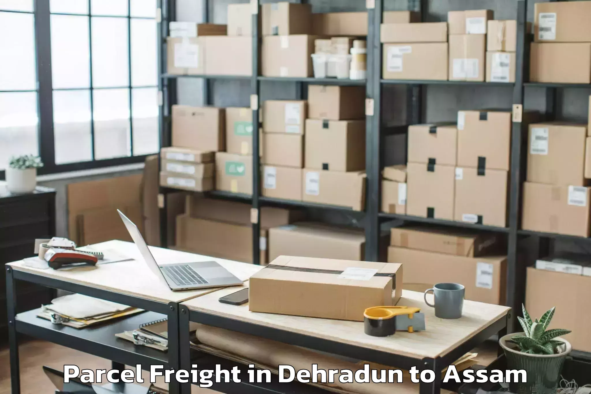 Affordable Dehradun to Moranhat Town Parcel Freight